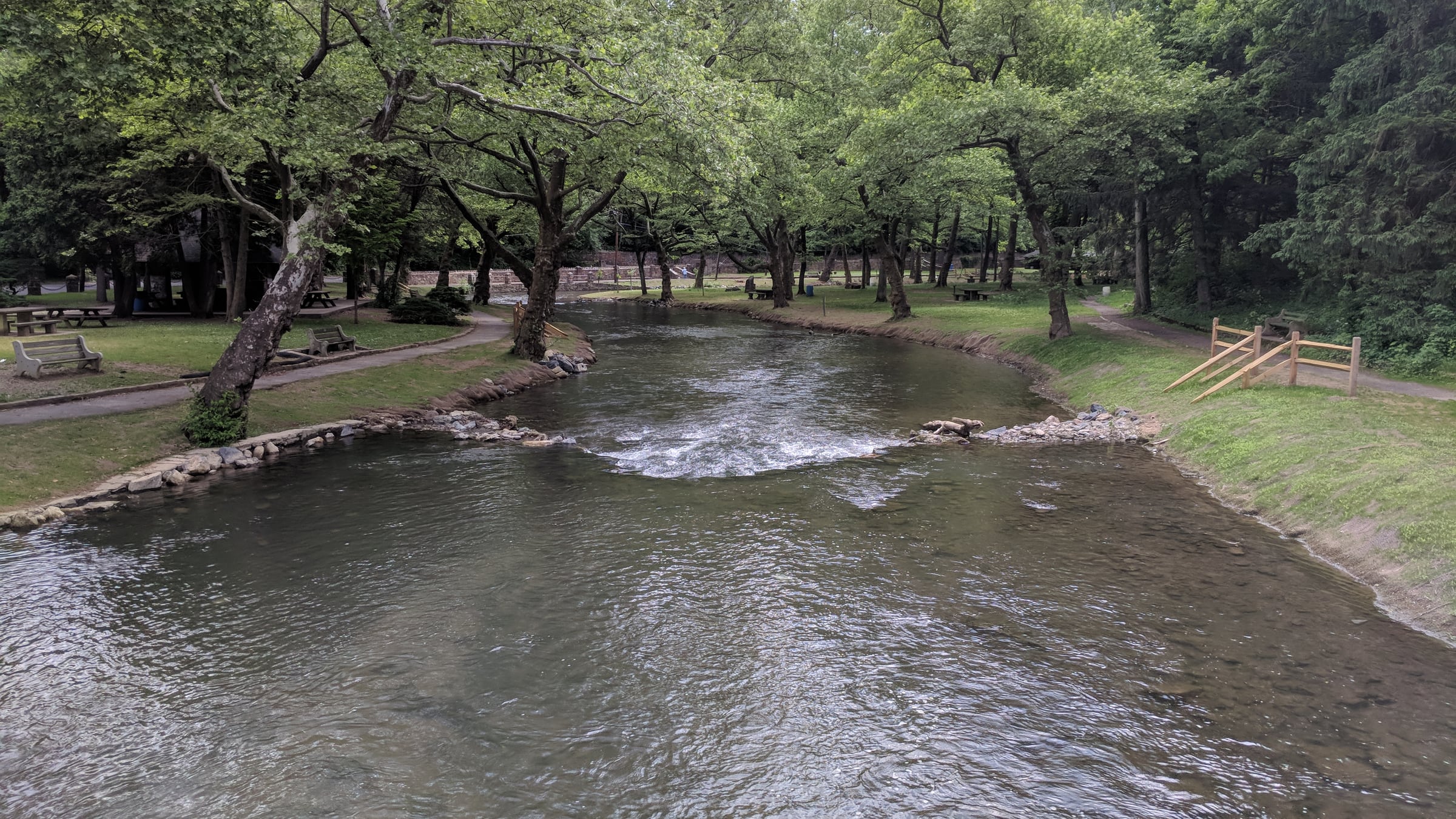 Monocacy Creek winding through a green park in Bethlehem